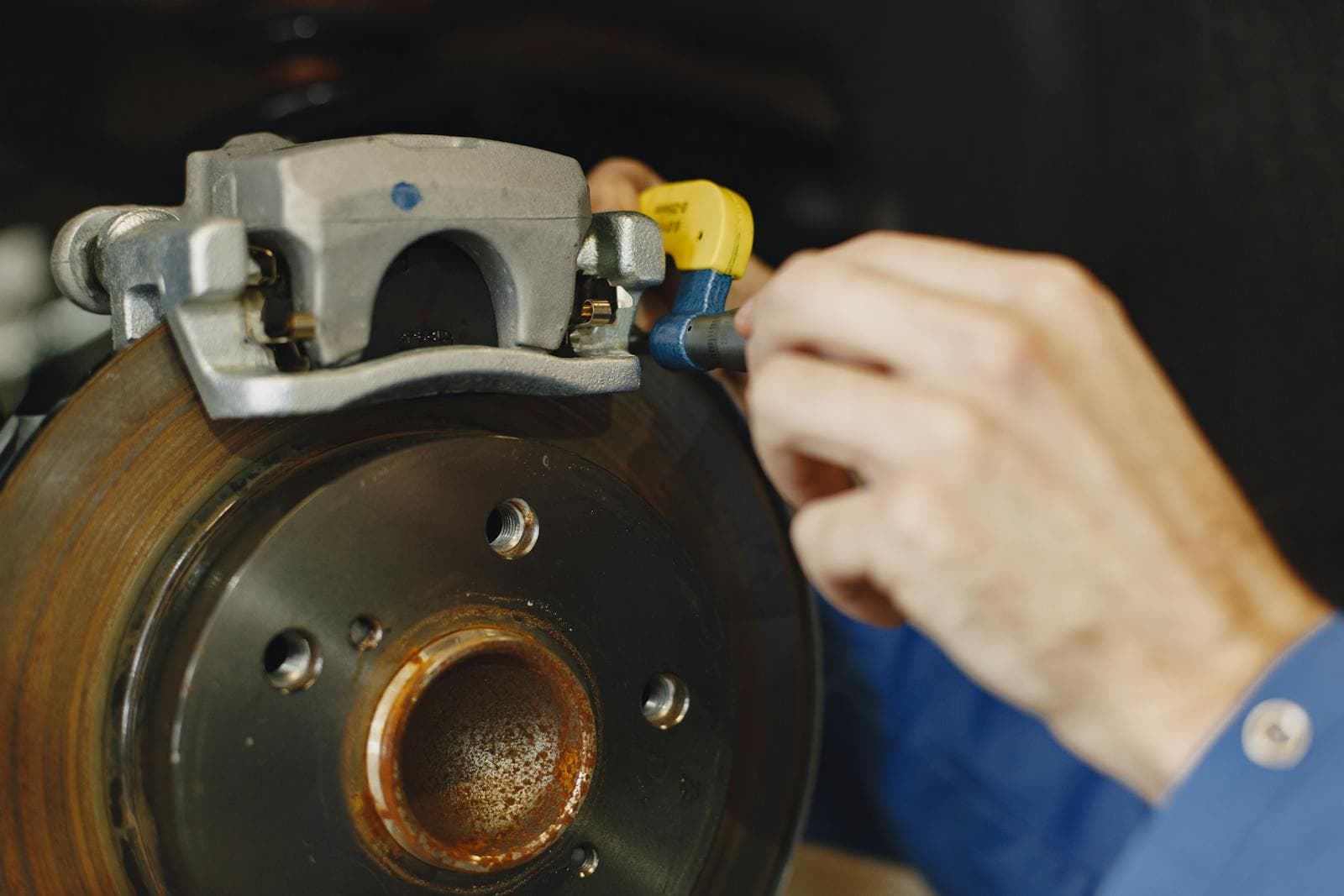 Close-up of a car brake disc and caliper