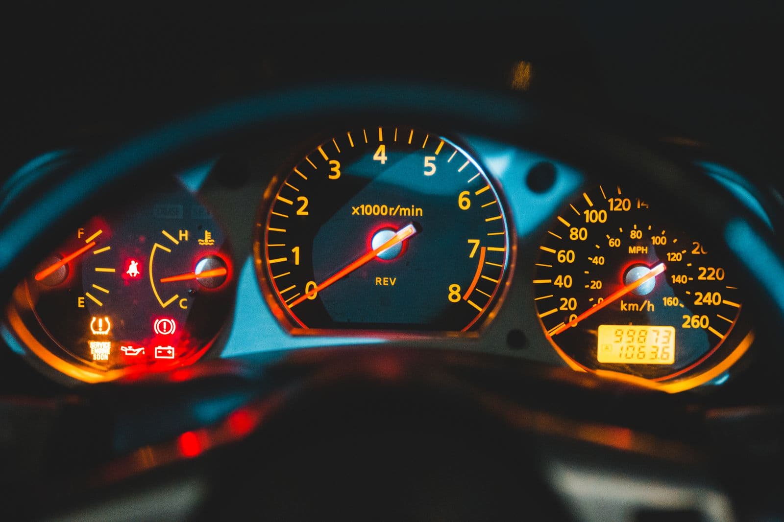 Car instrument cluster with oil, battery and tyre-pressure warning lights lit