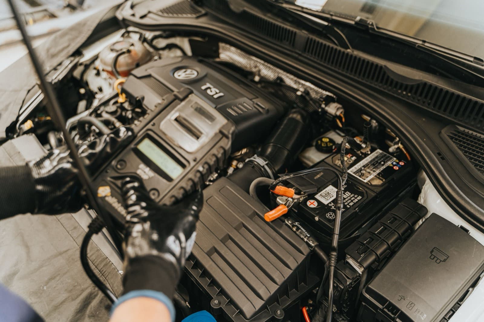 Diagnostic equipment connected in a car engine bay
