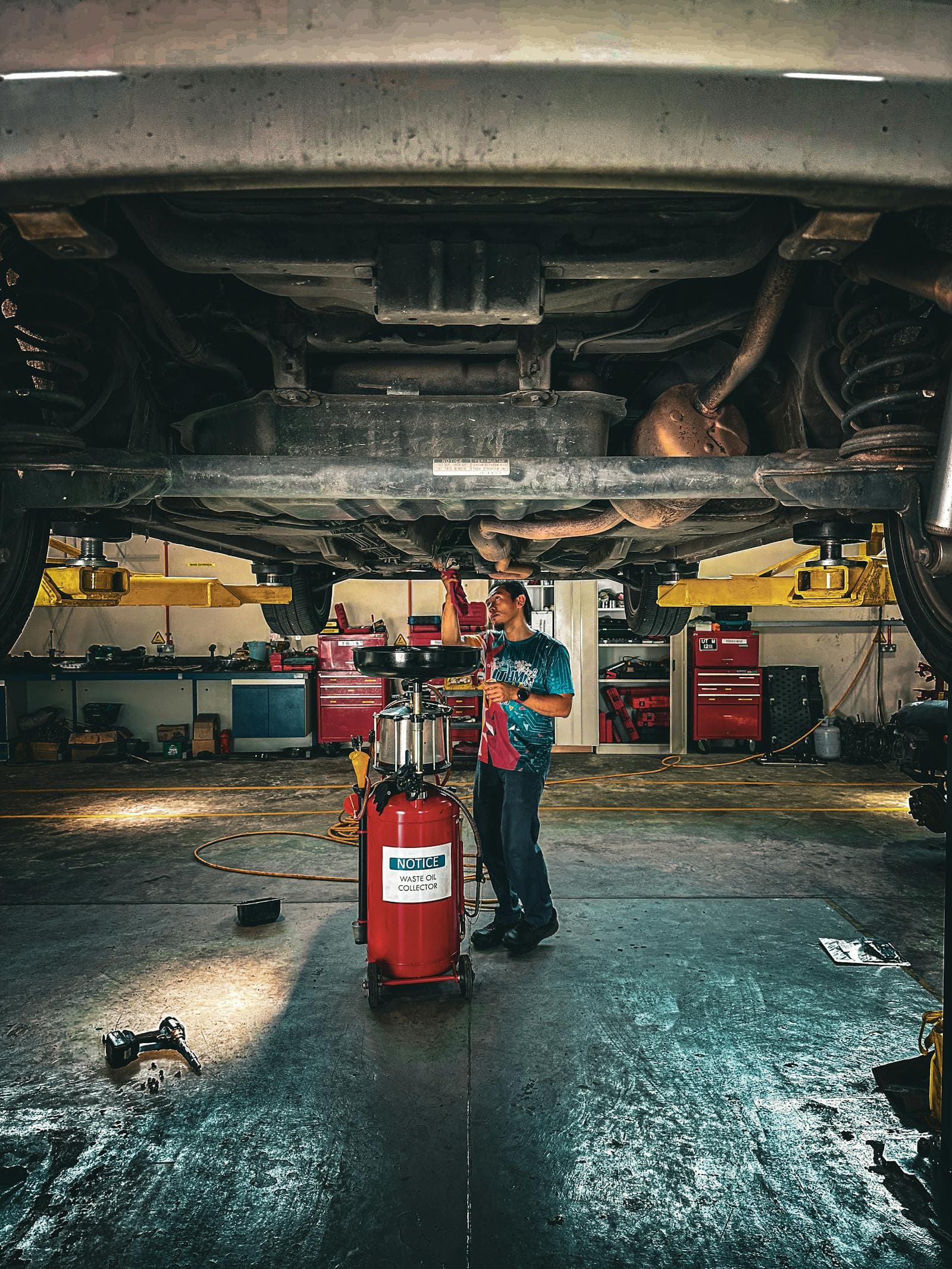 A car up on the hoist for a service at Speed Service